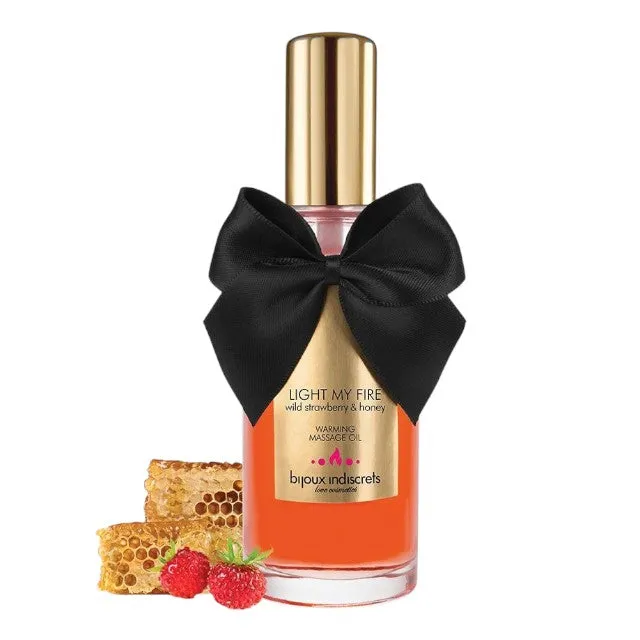 Ulei de masaj BIJOUX INDISCRETS Light My Fire Wild Strawberry. cu efect de încălzire. aromă de căpșuni și miere. 100 ml